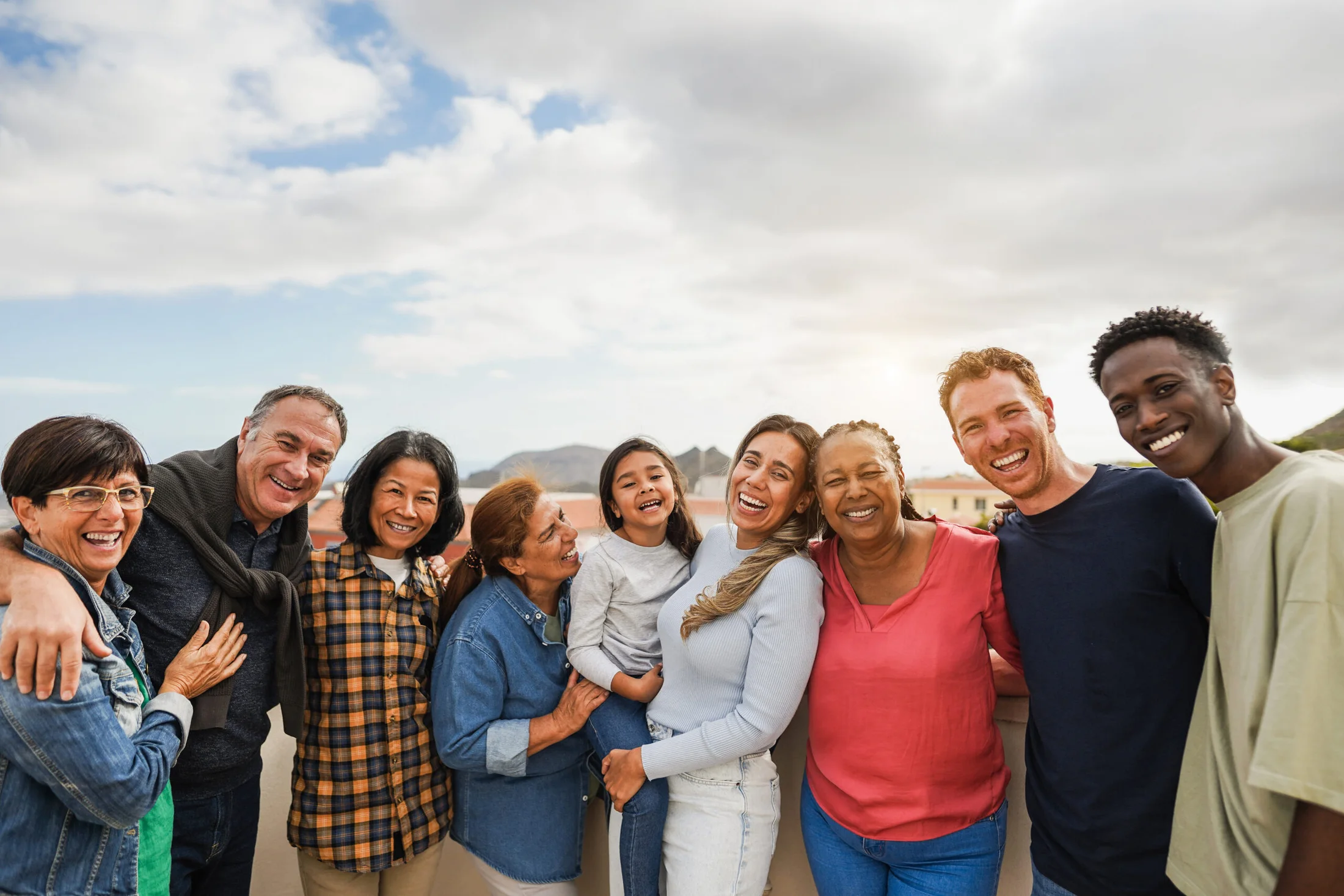 A multigenerational group smiling together